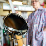 Lyn Carruthers making a self portrait in her studio in 2019